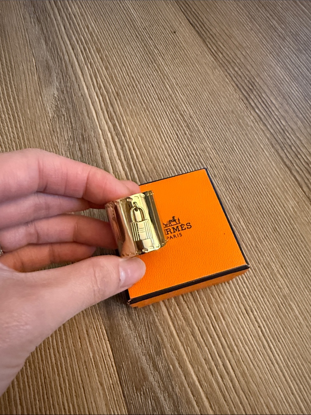 Hermès Gold scarf ring with charm